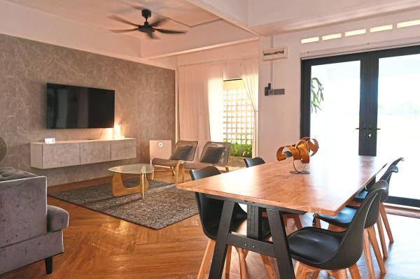 The soothing colour palette of the home features neutral shades of white, black, grey and brown. 