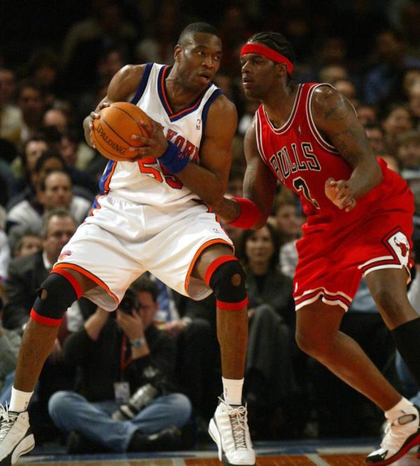 Knicks #55 Dikembe Mutombo looking for the opening as Bulls #2 Eddy Curry playing defense in the first quarter against the Bulls at Madison Square Garden on April 7, 2004.